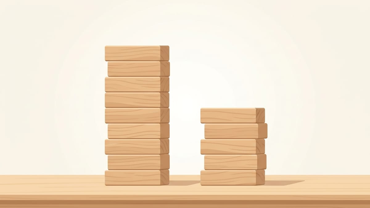 똑같은 나무 블록으로 쌓은 두 탑이 나란히 서 있고 왼쪽이 오른쪽보다 눈에 띄게 높은 모습